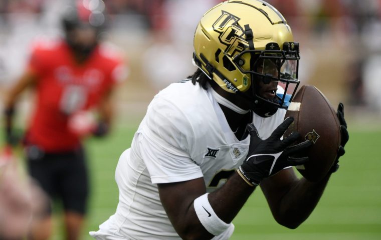 UCF's wide receiver Kobe Hudson (2) catches the ball against Texas Tech in a Big 12 football game, Saturday, Nov. 18, 2023, at Jones AT&T Stadium.