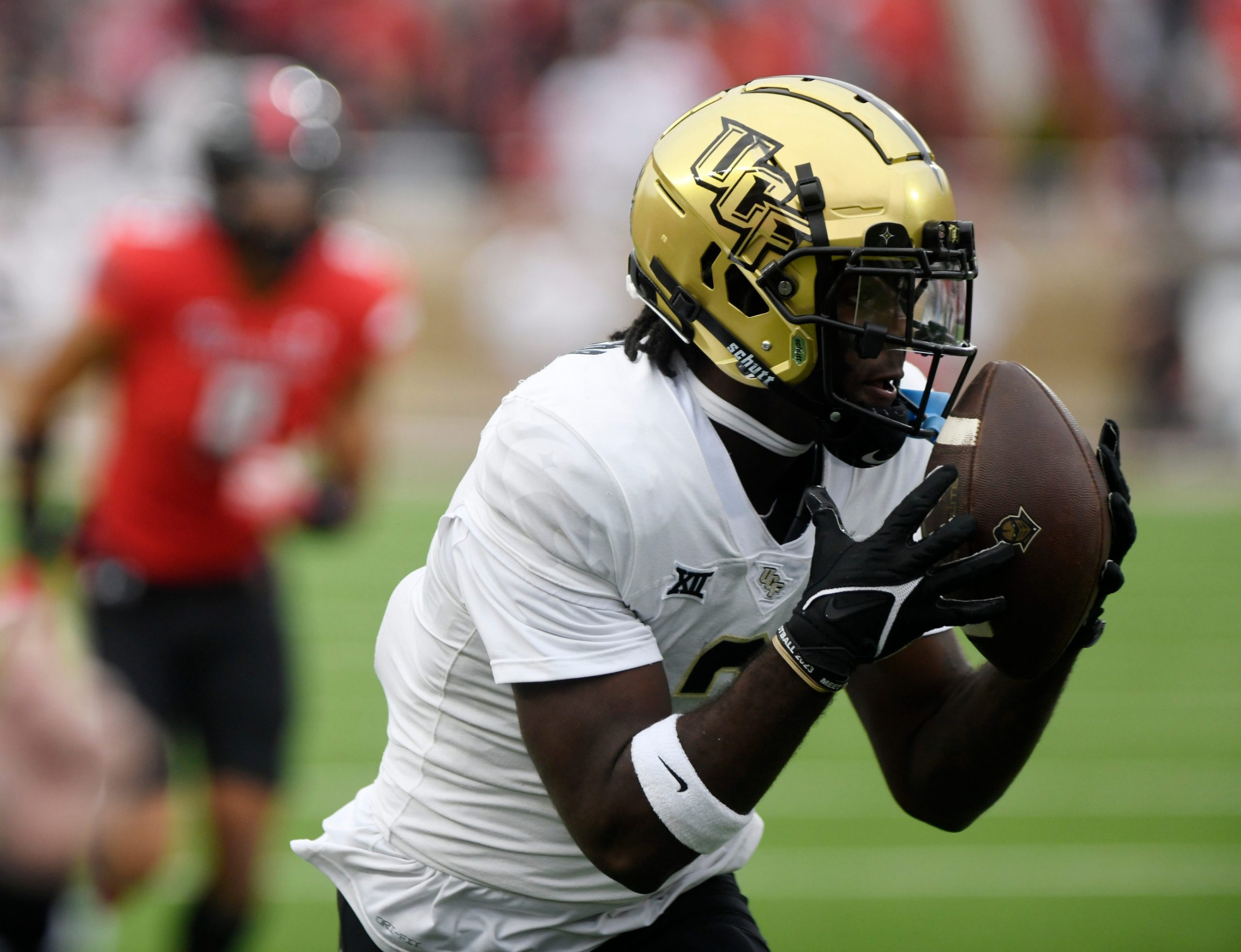 UCF's wide receiver Kobe Hudson (2) catches the ball against Texas Tech in a Big 12 football game, Saturday, Nov. 18, 2023, at Jones AT&T Stadium.