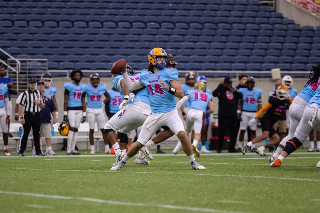 ©sportsclubflorida.com | Connor Degenhardy (American Team - Blue) from University of New Haven Completes one of many passes.