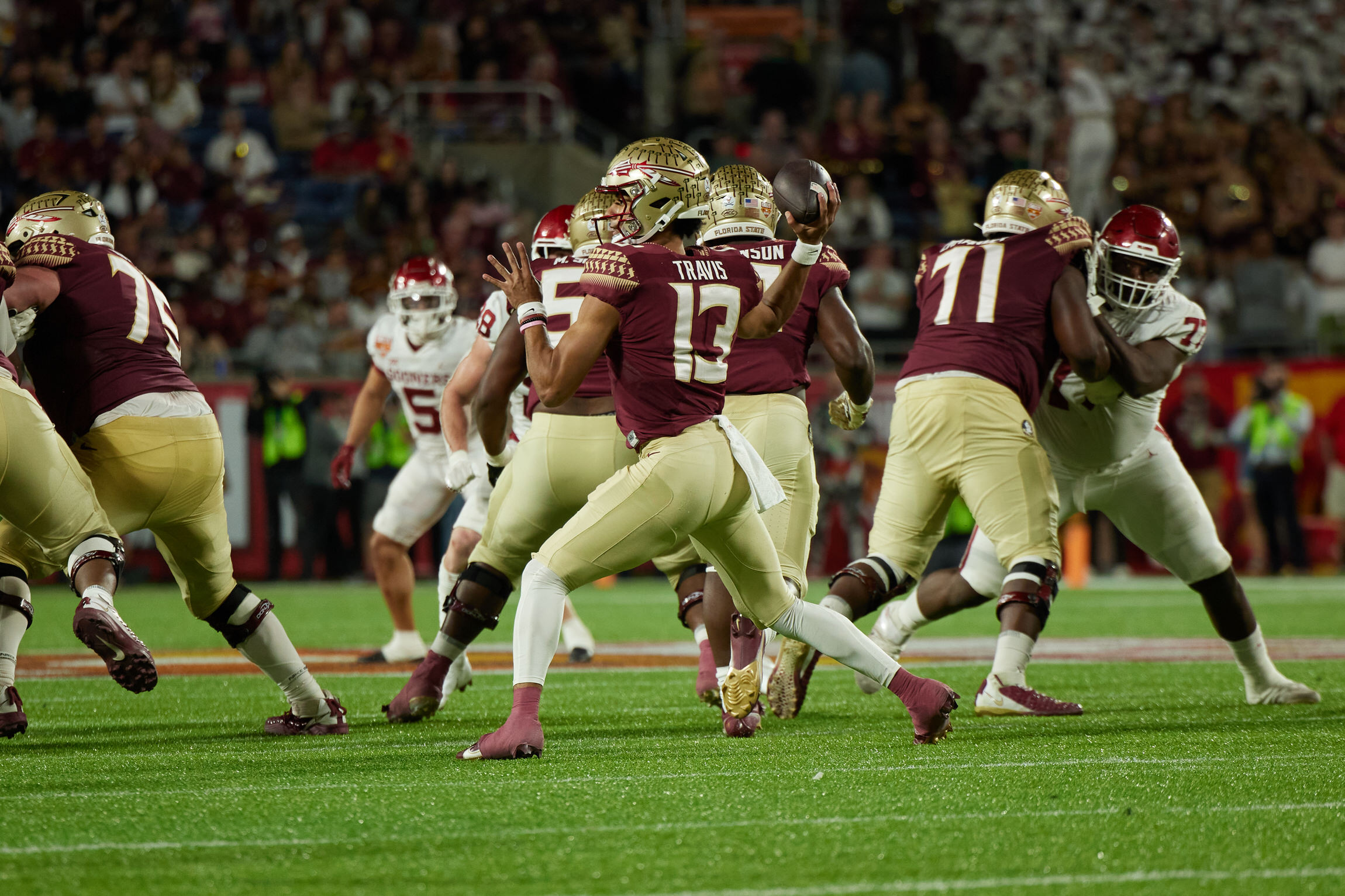 Travis #13 Throws the Football